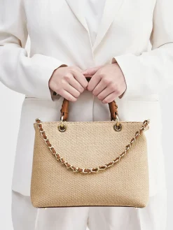 – Handtasche aus Kunstleder und Raffia*Konstantin Starke